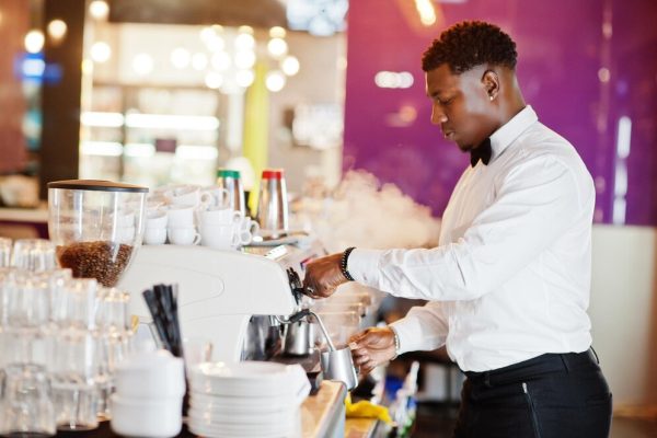 african-american-bartender-barista-bar-preparing-coffee_627829-13178